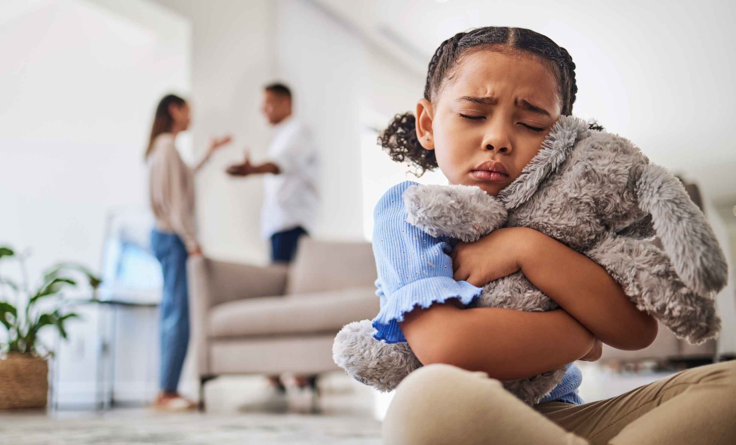 Parents Fight, Sad Girl and Teddy Hug of a Child Crying from Divorce in a Home Living Room. Depressed Kid, Problem and Youth Anxiety of Children Depression from Mama and Dad  Fighting